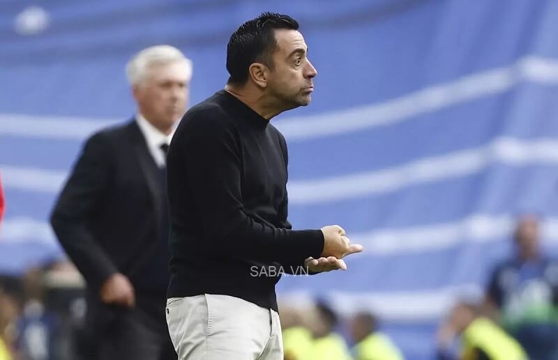 Xavi bất lực trước Real Madrid.